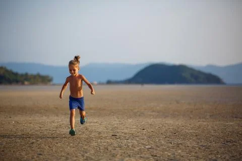 Little boy on the beach 写真素材