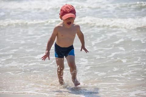 A little boy on the beach Stock Photos