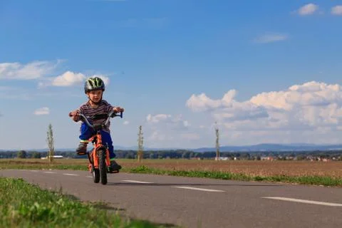 Little boy on a bicycle. Stock Photos
