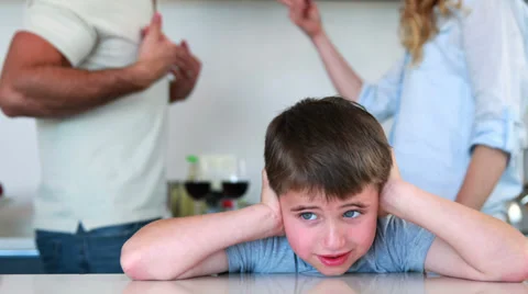 Little boy blocking out noise from parents fighting Stock Footage