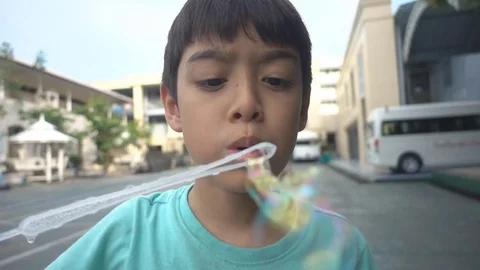 Little boy blowing bubble soap slow motion HD Stock video 스톡 동영상 74617194