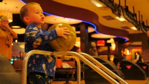 Little boy bowling and making funny arm movements. Stock Footage 86727095