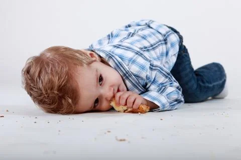 Little boy with bread Stock Photos