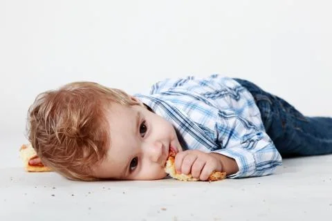 Little boy with bread Stock Photos