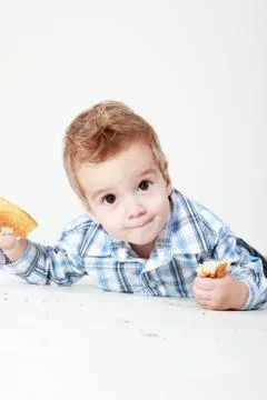 Little boy with bread Stock Photos