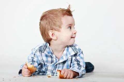 Little boy with bread Stock Photos