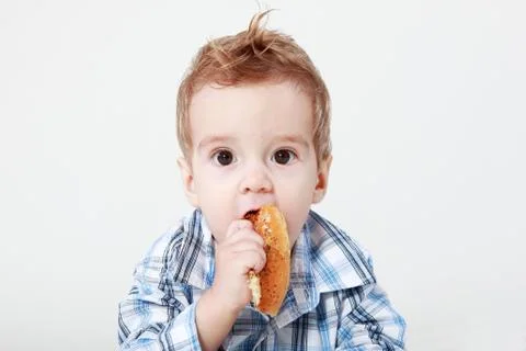 Little boy with bread Stock Photos