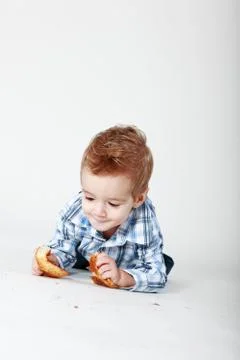 Little boy with bread Stock Photos