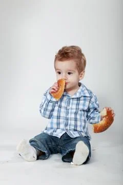Little boy with bread Stock Photos