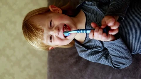 Little boy brushes his teeth with a toothbrush. Stock Footage 224706465
