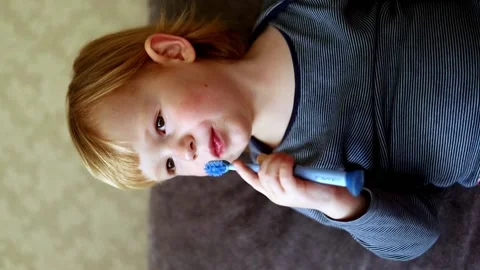 Little boy brushes his teeth with a toothbrush. Stock Footage 224706677