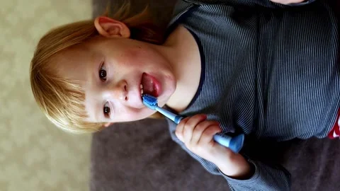 Little boy brushes his teeth with a toothbrush. Stock Footage 224706688