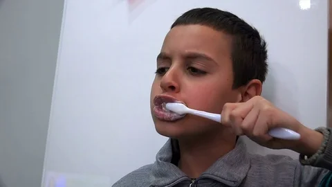 Little boy brushing his teeth in the morning Stock Footage 82213383
