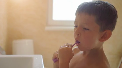 Little boy brushing his teeth Stock Footage 116395553