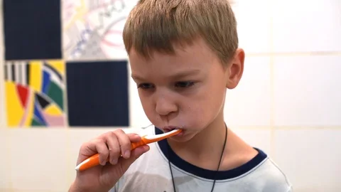 Little boy brushing his teeth in the bathroom Stock Footage 122106880