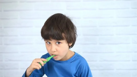 Little boy brushing his teeth Stock Footage 129446109