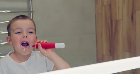 Little boy brushing his teeth Stock Footage 156809315