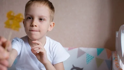 Little boy  with  candy on  stick Stock Footage 78496566