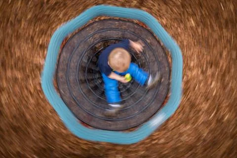 Little boy in a carousel Stock Photos