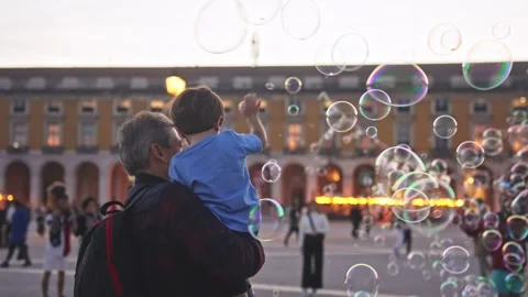 Little boy catch soap bubbles. Kid and father play together. Happy childhood. Stock Footage 271223133