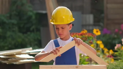 Little boy child future engineer builder architect with instruments, in uniforms Stock Footage 139728155