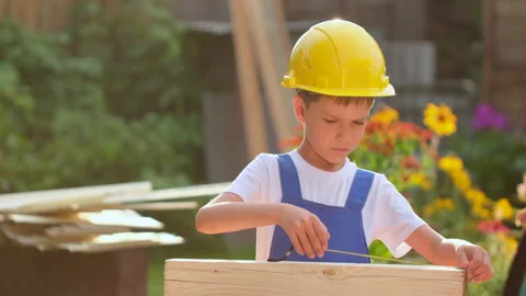 Little boy child future engineer builder architect with instruments, in uniforms Video stock 139728389