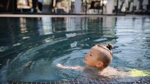 Little boy child learning swimming by himself. Kid on summer vacation Stock Footage 267284754