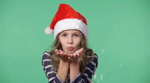 Little boy in a christmas cap throwing up confetti Stock Footage 68376846