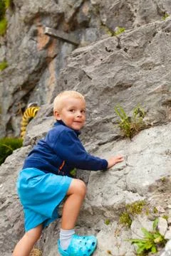 Little boy climbing Stock Photos