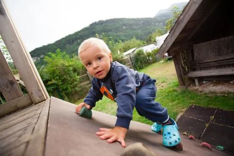 Little boy climbing Stock Photos