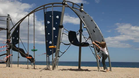 Little boy climbs on the climbing wall Stock Footage 24772339