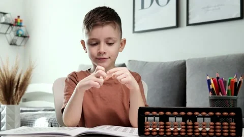 Little boy counting with the help of mental arithmetic. Mathematics in pleasure Stock Footage 236257728
