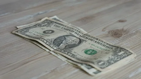 Little boy counts his one dollar bills Stock Footage 171579247