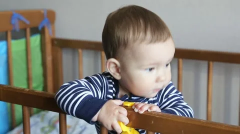 Little Boy is In the Crib Stock Footage 63373647