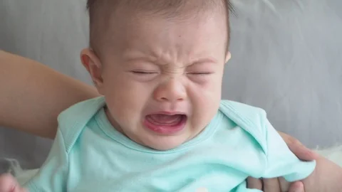 Little boy crying on bed Stock Footage 108645987