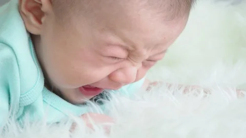 Little boy crying on bed Stock Footage 108646016
