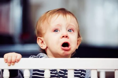 Little boy is crying in the bed Stock-Fotos