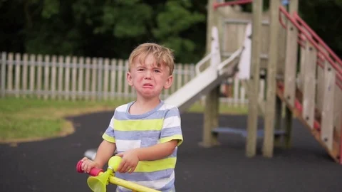 Little boy crying on the playground Stock Footage 81107218