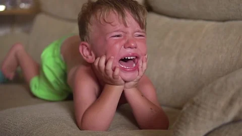Little Boy Crying  on the sofa Stock Footage 80268183