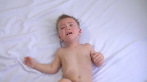 Little boy crying on a white background. Dependence on computer games Stock Footage 74722144