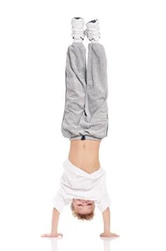 Little boy dancing on white Stock-Fotos