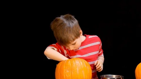 Little Boy Digging In Pumpkin Video stock 97768716