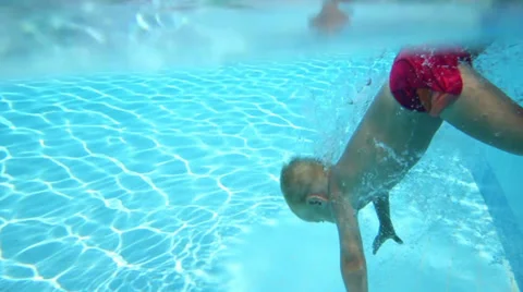 Little boy dive into pool and touch bottom and goes out 動画素材 35234938
