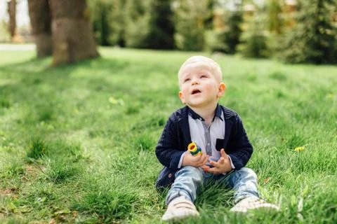Little boy do bubbles with his mother at park Stock Photos