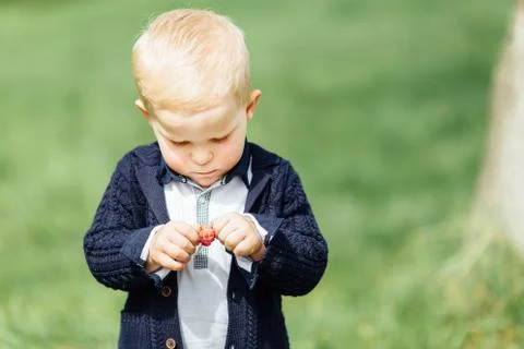 Little boy do bubbles with his mother at park Stock Photos