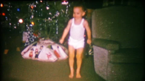 Little boy does his Happy Dance on Christmas 1950s vintage film home movie 2296 Vídeo Stock 51921868