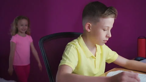 A little boy does his homework, writes useful information. Stock Footage 132036414