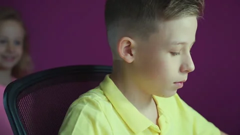 A little boy does his homework, writes useful information. Video stock 132036434