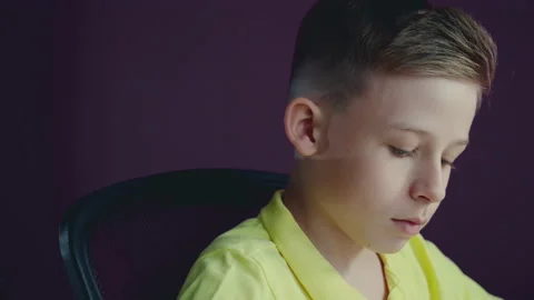 A little boy does his homework, writes useful information. Stock Footage 132060323
