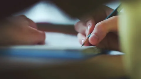 Little boy does homework, writes useful information. Slow Motion. Video stock 132034634